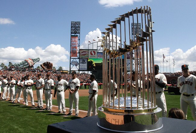 SAN FRANCISCO, CA - APRIL 08:  The 2010 World Series trophy is displayed as San Francisco Giants players line up before the start of the Giants' opening day game against the St. Louis Cardinals at AT&T Park on April 8, 2011 in San Francisco, California.
