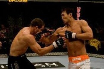 Yushin Okami landing a right hook