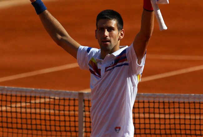 PARIS, FRANCE - MAY 29:  Novak Djokovic of Serbia celebrates matchpoint during the men's singles round four match between Richard Gasquet of France and Novak Djokovic of Serbia on day eight of the French Open at Roland Garros on May 29, 2011 in Paris, Fra