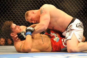 LAS VEGAS - JULY 11:  Brock Lesnar holds down Frank Mir during their heavyweight title bout during UFC 100 on July 11, 2009 in Las Vegas, Nevada.  (Photo by Jon Kopaloff/Getty Images)