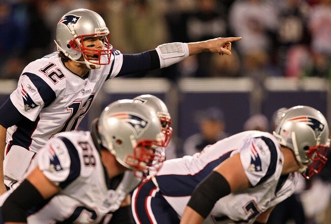 EAST RUTHERFORD, NJ - DECEMBER 29:  Tom Brady #12 of the New England Patriots points out the defense against the New York Giants on December 29, 2007 at Giants Stadium in East Rutherford, New Jersey.  (Photo by Al Bello/Getty Images)