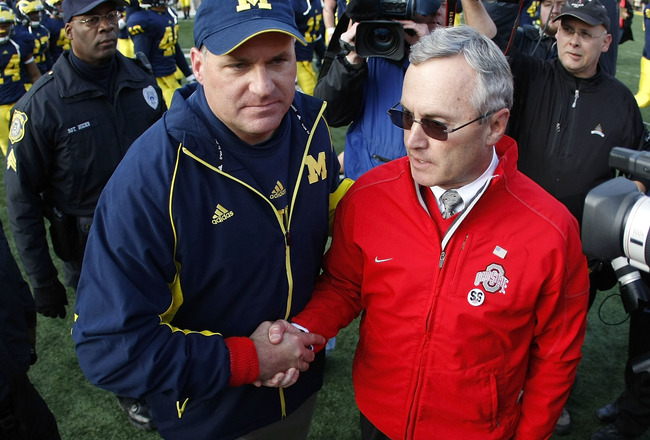 ANN ARBOR, MI - NOVEMBER 21: Head coach Jim Tressel of the Ohio State Buckeyes shakes hands after a 21-10 victory with head coach Rich Rodriguez of the Michigan Wolverines on November 21, 2009 at Michigan Stadium in Ann Arbor, Michigan.  (Photo by Gregory