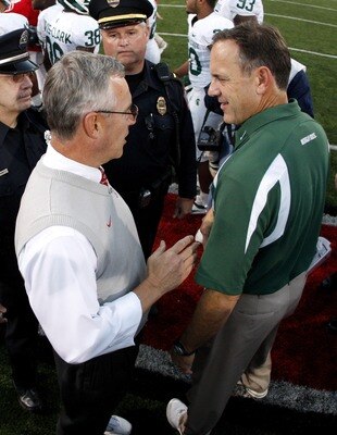 COLUMBUS, OH - OCTOBER 20: Jim Tressel head coach of the Ohio State Buckeyes shakes hands after 24-17 victory with Mark Dantonio head coach of the Michigan State Spartans at Ohio Stadium October 20, 2007 in Columbus, Ohio. (Photo By Gregory Shamus/Getty I