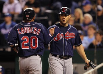 KANSAS CITY, MO - MAY 16:  Orlando Cabrera #20 of the Cleveland Indians is congratulated by Travis Hafner #48 after scoring during the game against the Kansas City Royals on May 16, 2011 at Kauffman Stadium in Kansas City, Missouri.  (Photo by Jamie Squir