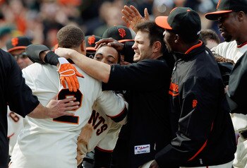 SAN FRANCISCO, CA - MAY 22: Darren Ford #34 of the San Francisco Giants gets mobbed after scoring the winning run on a single by Emmanuel Burriss #2 against the Oakland A's in the 11th inning at AT&T Park on May 22, 2011 in San Francisco, California. The
