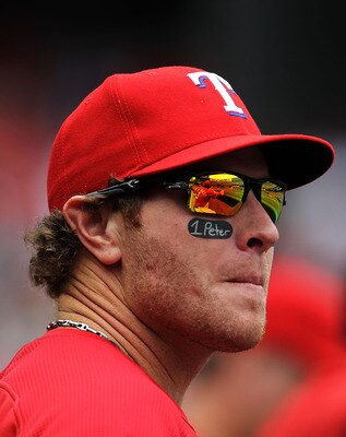 ARLINGTON, TX - APRIL 24:  Josh Hamilton #32 of the Texas Rangers watches from the dugout against the Kansas City Royals at Rangers Ballpark in Arlington on April 24, 2011 in Arlington, Texas.  (Photo by Ronald Martinez/Getty Images)