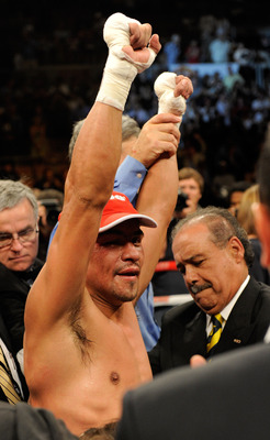 LAS VEGAS - JULY 31:  WBA/WBO lightweight champion 
Juan Manuel Marquez celebrates his unanimous-decison victory over Juan 
Diaz at the Mandalay Bay Events Center July 31, 2010 in Las Vegas, 
Nevada.  (Photo by Ethan Miller/Getty Images)