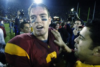 LOS ANGELES - NOVEMBER 30:  Quarterback Carson Palmer #3 of the University of Southern California Trojans celebrates after defeating the University of Notre Dame Fighting Irish at the Los Angeles Coliseum on November 30, 2002 in Los Angeles, California. T