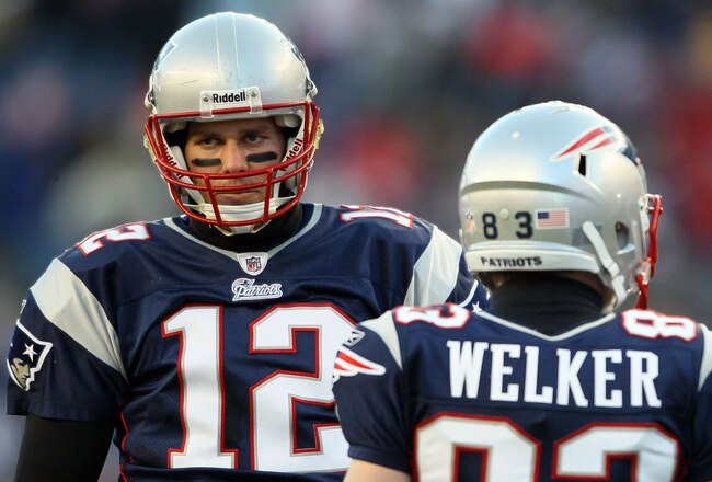 FOXBORO, MA - JANUARY 16:  Tom Brady #12 and Wes Welker #83 of the New England Patriots look on during their 2011 AFC divisional playoff game against the New York Jets at Gillette Stadium on January 16, 2011 in Foxboro, Massachusetts.  (Photo by Elsa/Gett