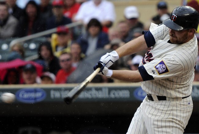 MINNEAPOLIS, MN - MAY 29: Jason Kubel #16 of the Minnesota Twins hits an RBI single against the Los Angeles Angels of Anaheim during the first inning of their game on May 29, 2011 at Target Field in Minneapolis, Minnesota. (Photo by Hannah Foslien/Getty I
