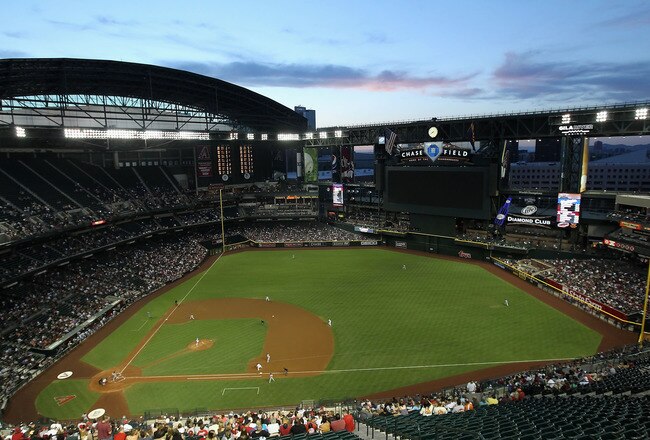 PHOENIX, AZ - JUNE 03:  General view of action as starting pitcher Josh Collmenter #55 of the Arizona Diamondbacks pitches against the Washington Nationals during the Major League Baseball game at Chase Field on June 3, 2011 in Phoenix, Arizona.  (Photo b