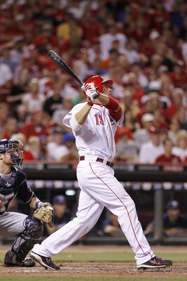 CINCINNATI, OH - JUNE 1: Joey Votto #19 of the Cincinnati Reds follows through on a two-run home run in the eighth inning against the Milwaukee Brewers at Great American Ball Park on June 1, 2011 in Cincinnati, Ohio. The Reds defeated the Brewers 4-3. (Ph