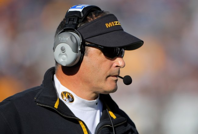 BOULDER, CO - OCTOBER 31:  Head coach Gary Pinkel of the Missouri Tigers leads his team against the Colorado Buffaloes at Folsom Field on October 31, 2009 in Boulder, Colorado. Missouri defeated Colorado 36-17.  (Photo by Doug Pensinger/Getty Images)