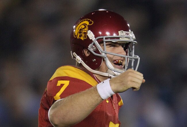 PASADENA, CA - DECEMBER 04:  Quarterback Matt Barkley #7 of the USC Trojans celebrates following a touchdown by running back Allen Bradford (not pictured) late in the second half against the UCLA Bruins at the Rose Bowl on December 4, 2010 in Pasadena, Ca