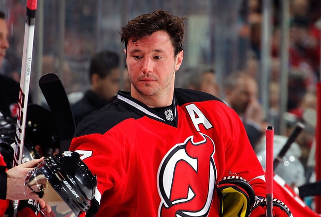 NEWARK, NJ - FEBRUARY 11: Ilya Kovalchuk #17 of the New Jersey Devils reaches to take his helmet in a timeout during an NHL hockey game against the San Jose Sharks on February 11, 2011 at the Prudential Center in Newark, New Jersey. (Photo by Paul Bereswi