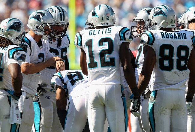 CHARLOTTE, NC - SEPTEMBER 19:  Jimmy Clausen #2 of the Carolina Panthers calls a play in the huddle against the Tampa Bay Buccaneers during their game at Bank of America Stadium on September 19, 2010 in Charlotte, North Carolina.  (Photo by Streeter Lecka