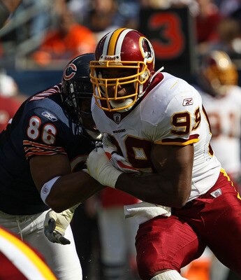 CHICAGO - OCTOBER 24: Andre Carter #99 of the Washington Redskins rushes against Brandon Manumaleuna #86 of the Chicago Bears at Soldier Field on October 24, 2010 in Chicago, Illinois. The Redskins defeated the Bears 17-14. (Photo by Jonathan Daniel/Getty