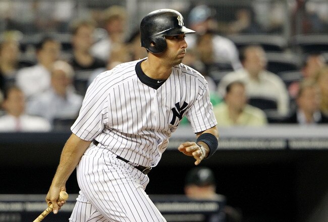 NEW YORK, NY - MAY 24:  Jorge Posada #20 of the New York Yankees hits a double in the ninth inning against the Toronto Blue Jays at Yankee Stadium on May 24, 2011 in the Bronx borough of New York City.  (Photo by Michael Heiman/Getty Images)