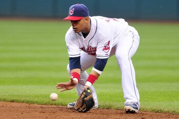 CLEVELAND, OH - JUNE 3: Orlando Cabrera #20 of the Cleveland Indians fields a ground ball during the fourth inning against the Texas Rangers at Progressive Field on June 3, 2011 in Cleveland, Ohio.  (Photo by Jason Miller/Getty Images)