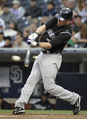 SAN DIEGO, CA - JUNE 7: Seth Smith #7 of the Colorado Rockies connects for a single during the second inning of a baseball game against the San Diego Padres at Petco Park on June 7, 2011 in San Diego, California.  (Photo by Denis Poroy/Getty Images)