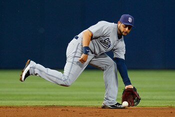ATLANTA, GA - JUNE 01:  Jason Bartlett #8 of the San Diego Padres scoops up a ground ball hit by Jordan Schafer #1 of the Atlanta Braves in the fourth inning at Turner Field on June 1, 2011 in Atlanta, Georgia.  (Photo by Kevin C. Cox/Getty Images)
