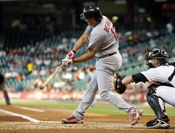 HOUSTON - JUNE 07:  Left fielder Lance Berkman #12 of the St. Louis Cardinals hits a two run home run to left center field in the first inning against the Houston Astros at Minute Maid Park on June 7, 2011 in Houston, Texas.  (Photo by Bob Levey/Getty Ima
