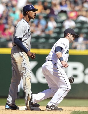 SEATTLE, WA - JUNE 04:  B.J. Upton #2 of the Tampa Bay Rays reacts after being tagged out on a steal attempt by Adam Kennedy #4 of the Seattle Mariners at Safeco Field on June 4, 2011 in Seattle, Washington. The Rays defeated the Mariners 3-2. (Photo by O