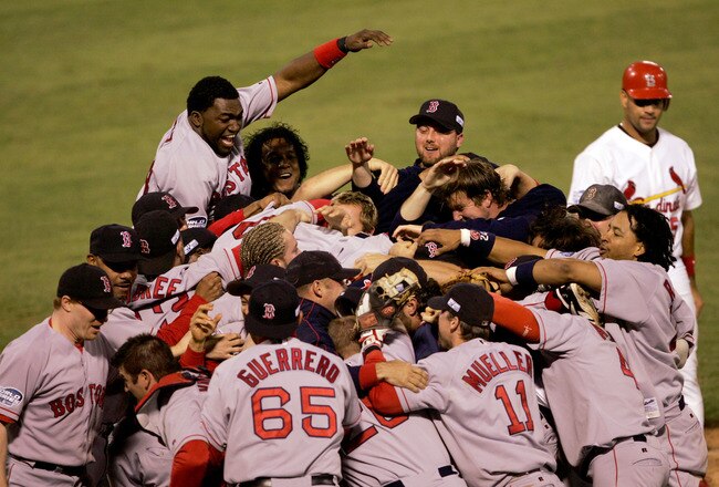 ST LOUIS - OCTOBER 27:  The Boston Red Sox celebrate after defeating the St. Louis Cardinals 3-0 to win game four of the World Series on October 27, 2004 at Busch Stadium in St. Louis, Missouri.  (Photo by Stephen Dunn/Getty Images)