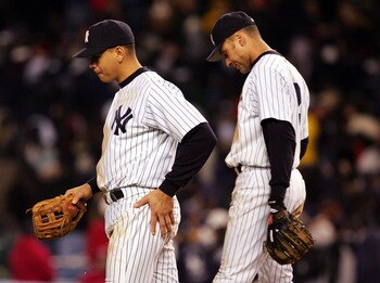 NEW YORK - OCTOBER 20:  Alex Rodriguez #13 and Derek Jeter #2 of the New York Yankees walk back to the dugout after the end of the eighth inning against the Boston Red Sox during game seven of the American League Championship Series on October 20, 2004 at