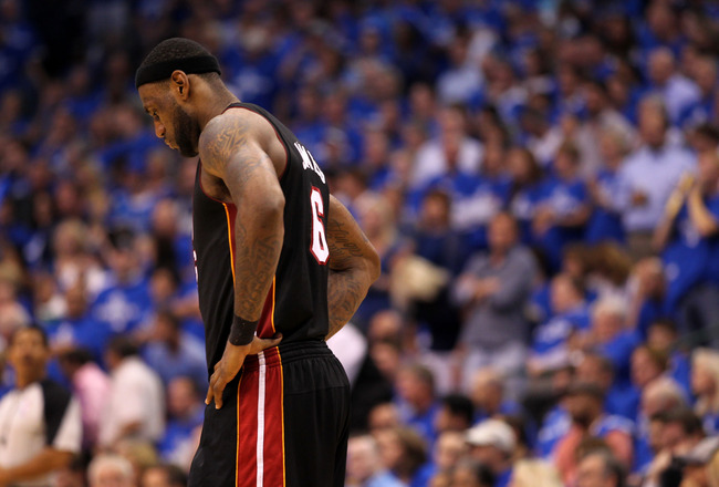 DALLAS, TX - JUNE 09:  LeBron James #6 of the Miami Heat stands on the court with his head down against the Dallas Mavericks in the fourth quarter of Game Five of the 2011 NBA Finals at American Airlines Center on June 9, 2011 in Dallas, Texas.  NOTE TO U