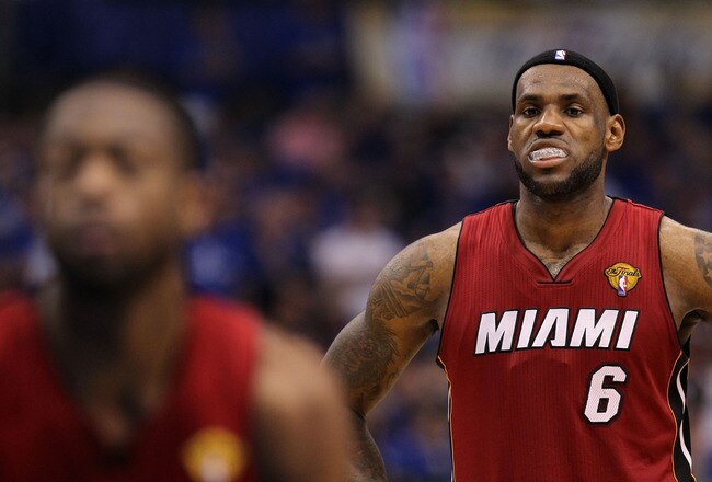 DALLAS, TX - JUNE 07:  LeBron James #6 of the Miami Heat looks on while teammate Dwyane Wade #3 shoots a free throw while taking on the Dallas Mavericks in Game Four of the 2011 NBA Finals at American Airlines Center on June 7, 2011 in Dallas, Texas. NOTE