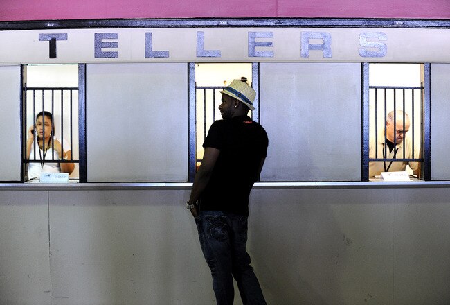 BALTIMORE - MAY 21: A man places a bet prior to the 136th running of the Preakness Stakes at Pimlico Race Course on May 21, 2011 in Baltimore, Maryland. (Photo by Patrick Smith/Getty Images)