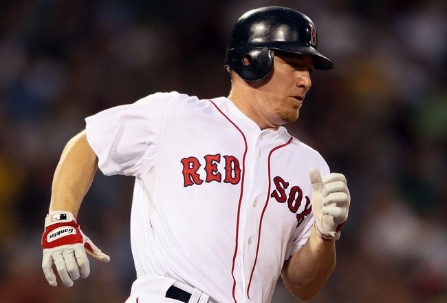 BOSTON - JULY 15:  J.D. Drew #7 of the Boston Red Sox rounds the bases after his solo home run in the fourth inning against the Texas Rangers on July 15, 2010 at Fenway Park in Boston, Massachusetts.  (Photo by Elsa/Getty Images)
