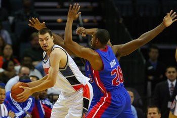 CHARLOTTE, NC - NOVEMBER 3:  Adam Morrison #35 of the Charlotte Bobcats looks for an open pass under pressure from Jason Maxiell #54 and Arron Afflalo #28 of the Detroit Pistons during the game on November 3, 2008 at Time Warner Cable Arena in Charlotte,
