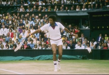 Arthur Ashe runs for the ball during a match at Wimbledon in England.