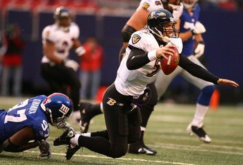 EAST RUTHERFORD, NJ - NOVEMBER 16:  Mathias Kiwanuka #97 of the New York Giants sacks Joe Flacco #5 of the Baltimore Ravens during their game on November 16, 2008 at Giants Stadium in East Rutherford, New Jersey.  (Photo by Al Bello/Getty Images)