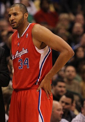 DALLAS, TX - JANUARY 25:  Head coach Vinny Del Negro and Brian Cook #34 of the Los Angeles Clippers at American Airlines Center on January 25, 2011 in Dallas, Texas.  NOTE TO USER: User expressly acknowledges and agrees that, by downloading and or using t