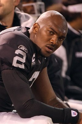 OAKLAND, CA - SEPTEMBER 8:  Quarterback JaMarcus Russell #2 of the Oakland Raiders looks on from the bench during the NFL game against the Denver Broncos on September 8, 2008 at McAfee Coliseum in Oakland, California. The Broncos defeated the Raiders 41-1