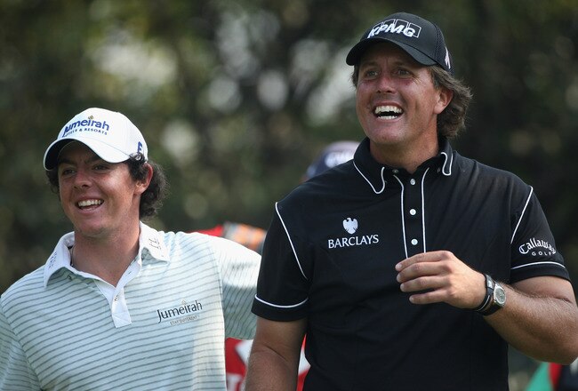 SHANGHAI, CHINA - NOVEMBER 06:  Phil Mickelson of the USA (right) and Rory McIlroy of Northern Ireland share a joke on the fifth hole during the second round of the WGC-HSBC Champions at Sheshan International Golf Club on November 6, 2009 in Shanghai, Chi
