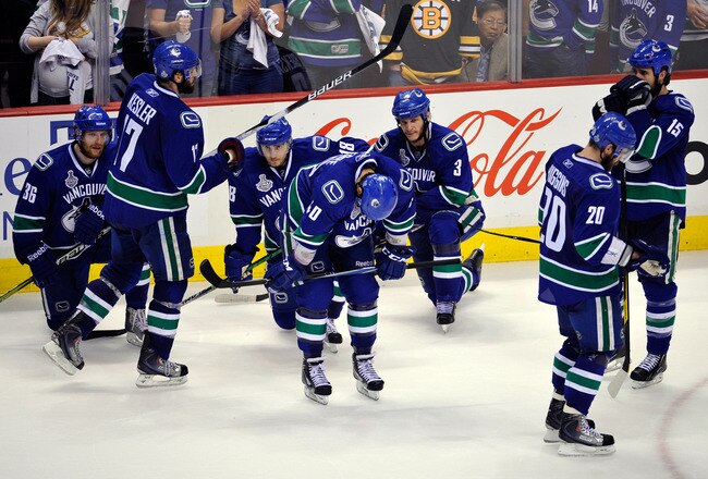 VANCOUVER, BC - JUNE 15:  The Vancouver Canucks react after being defeated by the Boston Bruins in Game Seven of the 2011 NHL Stanley Cup Final at Rogers Arena on June 15, 2011 in Vancouver, British Columbia, Canada. The Boston Bruins defeated the Vancouv