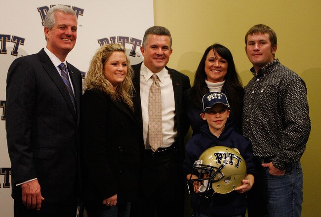 PITTSBURGH - JANUARY 11:  The new University of Pittsburgh head football coach, Todd Graham (center), poses for a photograph with members of his family and University of Pittsburgh athletic director, Steve Pederson (far left), during a press conference on