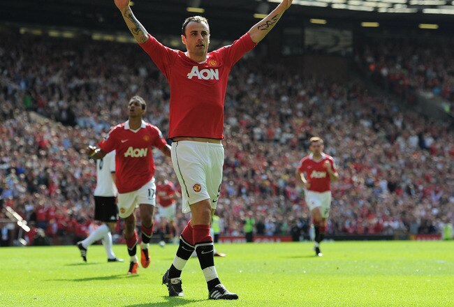 MANCHESTER, ENGLAND - APRIL 09:  Dimitar Berbatov of Manchester United celebrates scoring the opening goal during the Barclays Premier League match between Manchester United and Fulham at Old Trafford on April 9, 2011 in Manchester, England.  (Photo by Mi