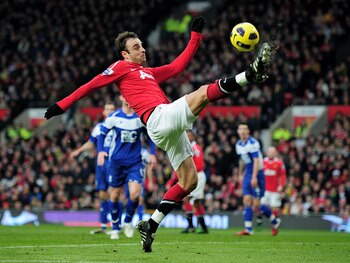 MANCHESTER, ENGLAND - JANUARY 22:  Dimitar Berbatov of Manchester United in action during the Barclays Premier League match between Manchester United and Birmingham City at Old Trafford on January 22, 2011 in Manchester, England.  (Photo by Shaun Botteril