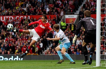 MANCHESTER, ENGLAND - AUGUST 28:  Dimitar Berbatov of Manchester United scores his team's third goal during the Barclays Premier League match between Manchester United and West Ham United at Old Trafford on August 28, 2010 in Manchester, England. (Photo b