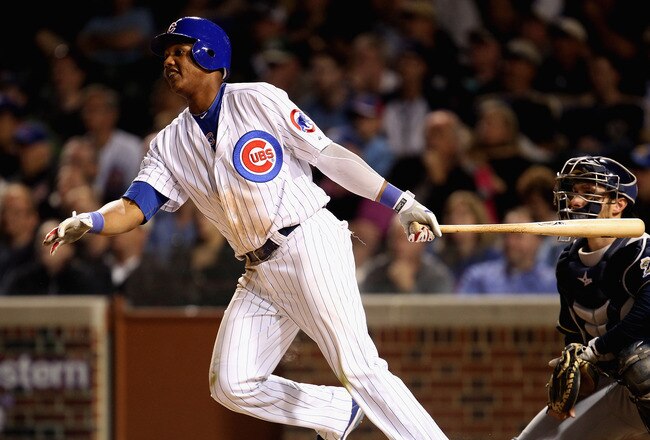 CHICAGO, IL - JUNE 14:  Starlin Castro #13 of the Chicago Cubs hits a double against the Milwaukee Brewers at Wrigley Field on June 14, 2011 in Chicago, Illinois. The Cubs defeated the Brewers 5-4 in 10 innings.  (Photo by Jonathan Daniel/Getty Images)