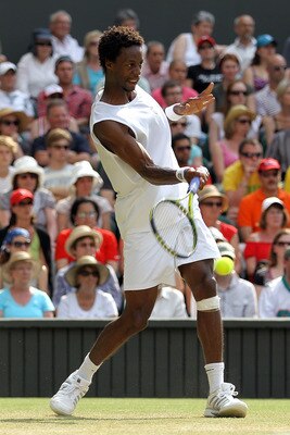 LONDON, ENGLAND - JUNE 25:  Gael Monfils of France plays a shot during his match against Lleyton Hewitt of Australia on Day Five of the Wimbledon Lawn Tennis Championships at the All England Lawn Tennis and Croquet Club on June 25, 2010 in London, England
