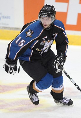 MISSISSAUGA, CANADA - MAY 21:  Steele Boomer #15 of the Kootenay Ice skates against the Owen Sound Attack during the 2011 CHL Mastercard Memorial Cup game on May 21, 2011 at the Hershey Centre in Mississauga, Canada. The Attack defeated the Ice 5-0. (Phot