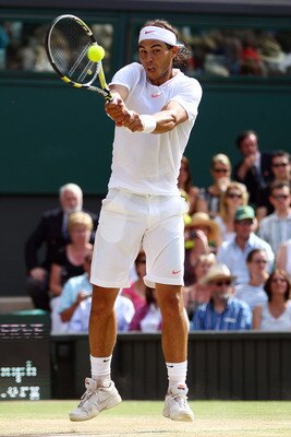 LONDON, ENGLAND - JULY 04:  Rafael Nadal of Spain plays a shot during the Men's Singles Final match against Tomas Berdych of Czech Republic on Day Thirteen of the Wimbledon Lawn Tennis Championships at the All England Lawn Tennis and Croquet Club on July