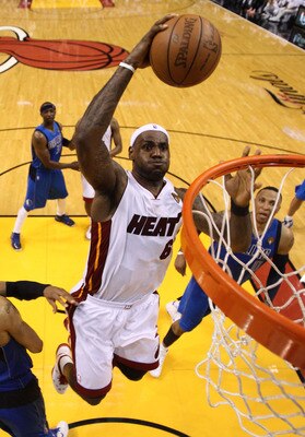 MIAMI, FL - MAY 31:  LeBron James #6 of the Miami Heat dunks the ball over Tyson Chandler #6 of the Dallas Mavericks in the fourth quarter in Game One of the 2011 NBA Finals at American Airlines Arena on May 31, 2011 in Miami, Florida. NOTE TO USER: User
