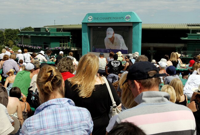 LONDON, ENGLAND - JULY 04:  Tennis fans watch the big screen on Henman Hill during the Men's Singles Final match between Rafael Nadal of Spain and Tomas Berdych of Czech Republic on Day Thirteen of the Wimbledon Lawn Tennis Championships at the All Englan